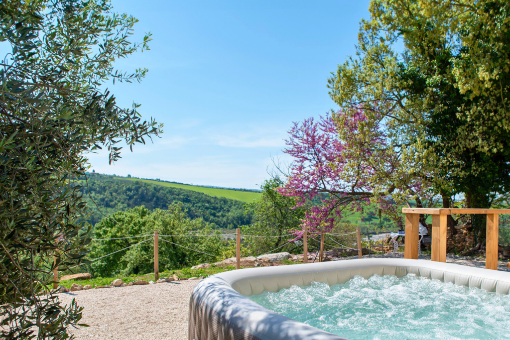 Private hot tub on the veranda of a glamping Eco-Suite, ten minutes from the Saturnia hot springs
